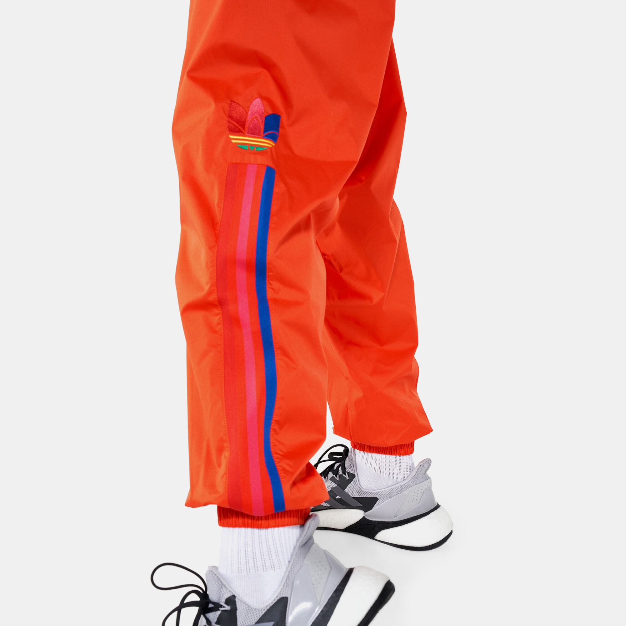 Men's green track pants with red stripe store