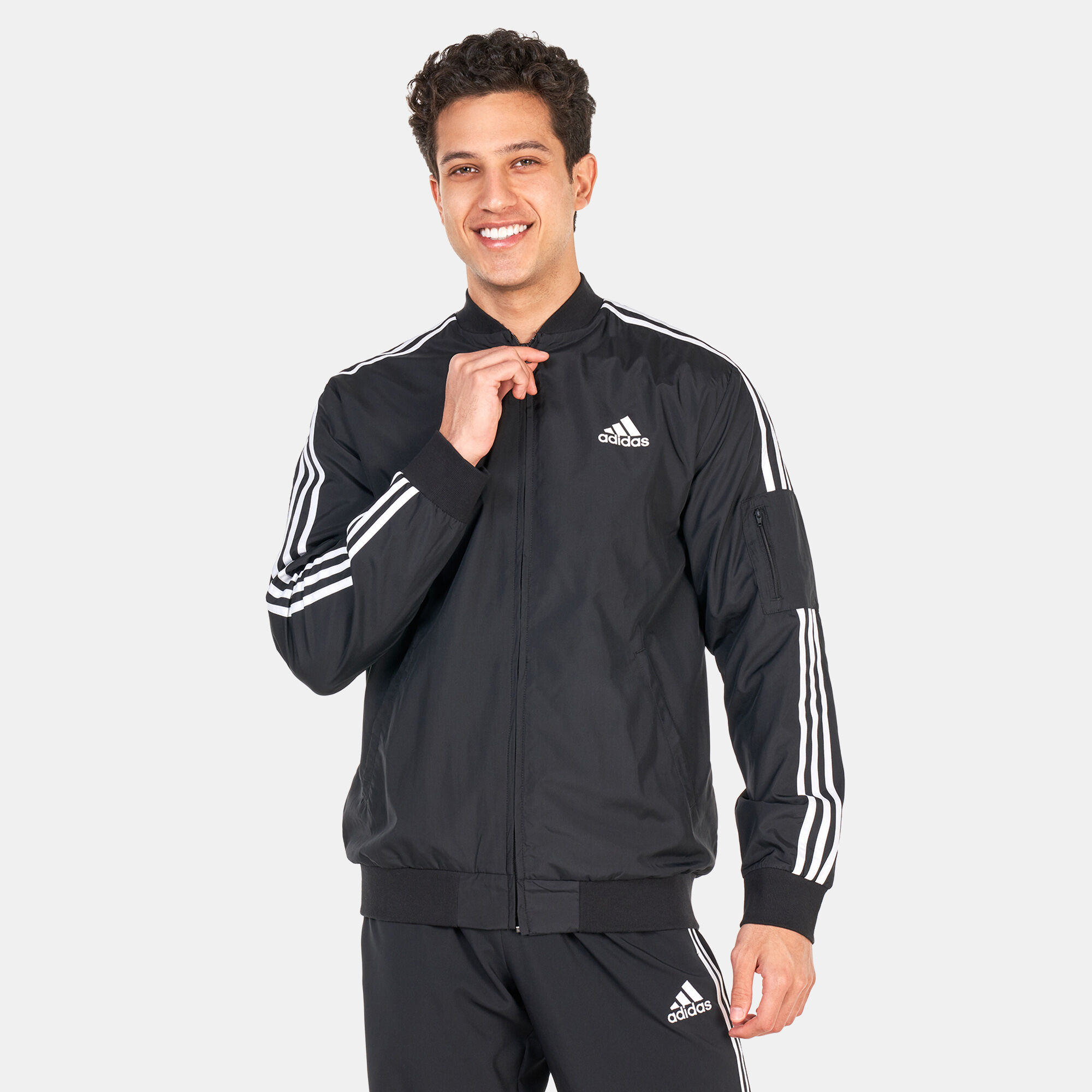 Buy adidas Men s Essentials Woven 3 Stripes Jacket Black in Kuwait
