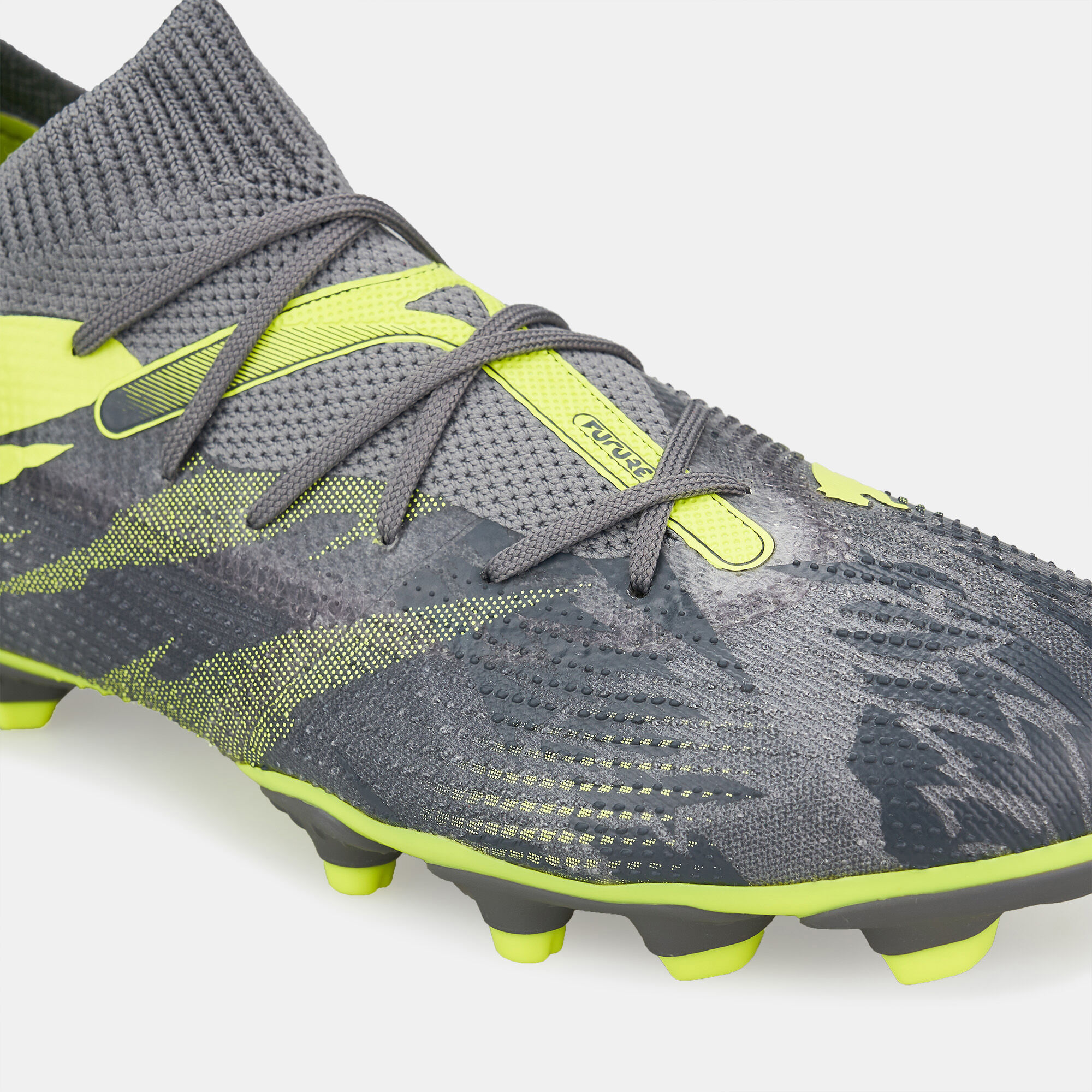 grey and yellow football boots