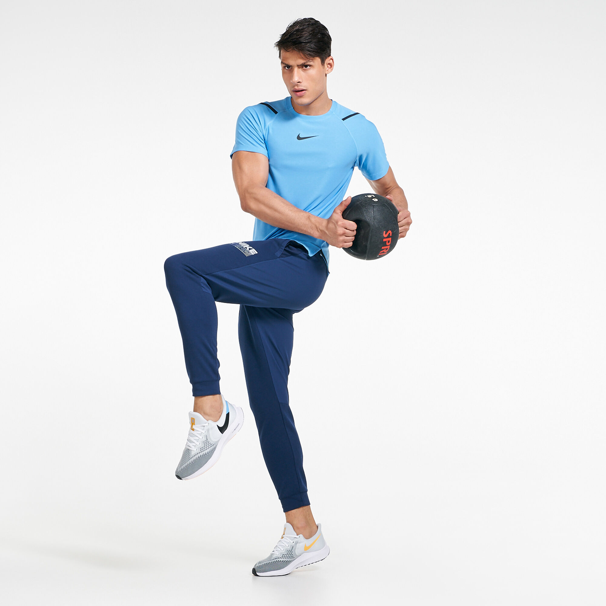 Nike tapered track pants hot sale