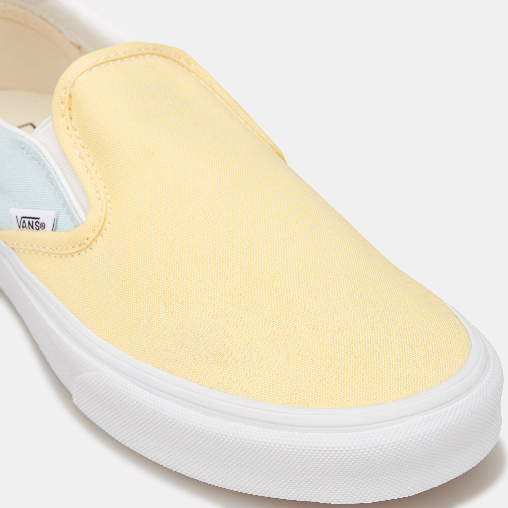 Pastel yellow vans slip ons top